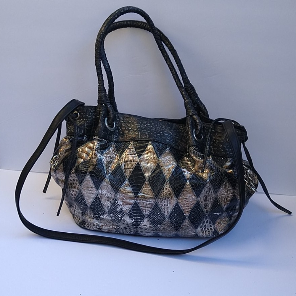 A black and silver shoulder purse.